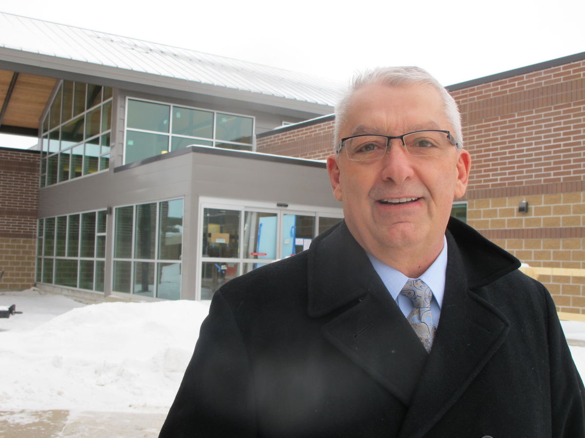 Sakakawea Medical Center CEO Darrold Bertsch stands in front of the new hospital-clinic facility that will open for operations toward the end of February. The opening is further out than planned, but he promises the facility will be well worth the wait. 